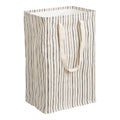 Cesto de ropa textil beige y negro
