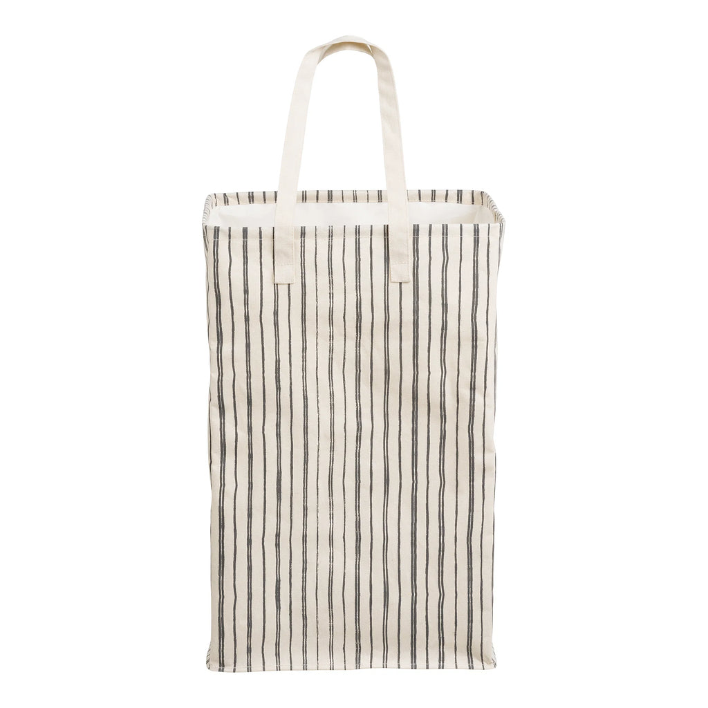 Cesto de ropa textil beige y negro